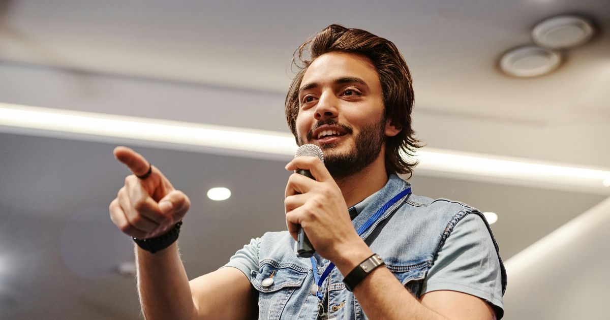 A young man public speaking with confidence