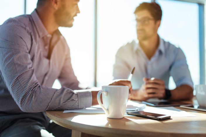 two people having a difficult conversation at work